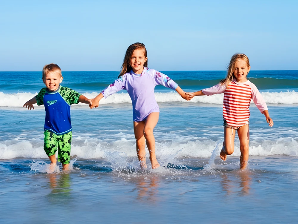Kids playing in the surf at the beach